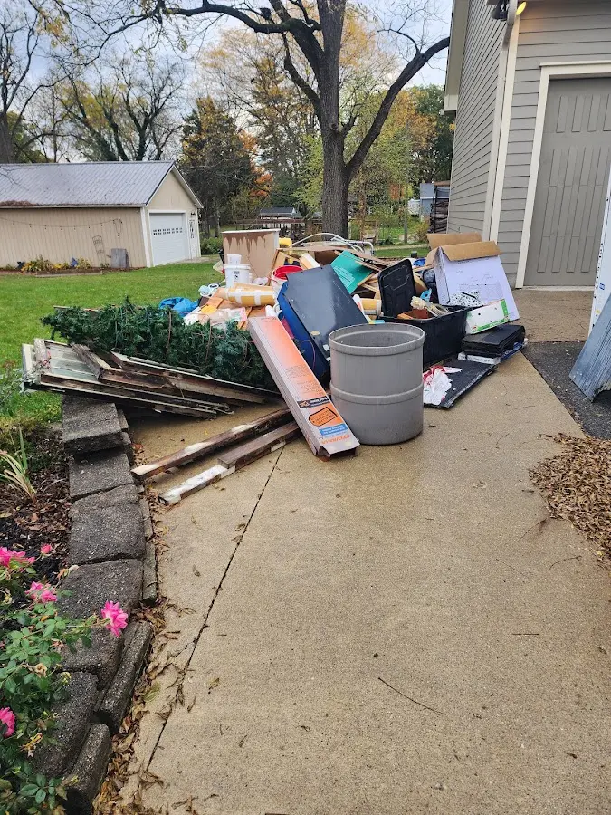 Dumpster being loaded with debris for 30 Yard Dumpster Rental in Murray